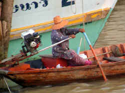 Woman in Longtail (Chumpong)